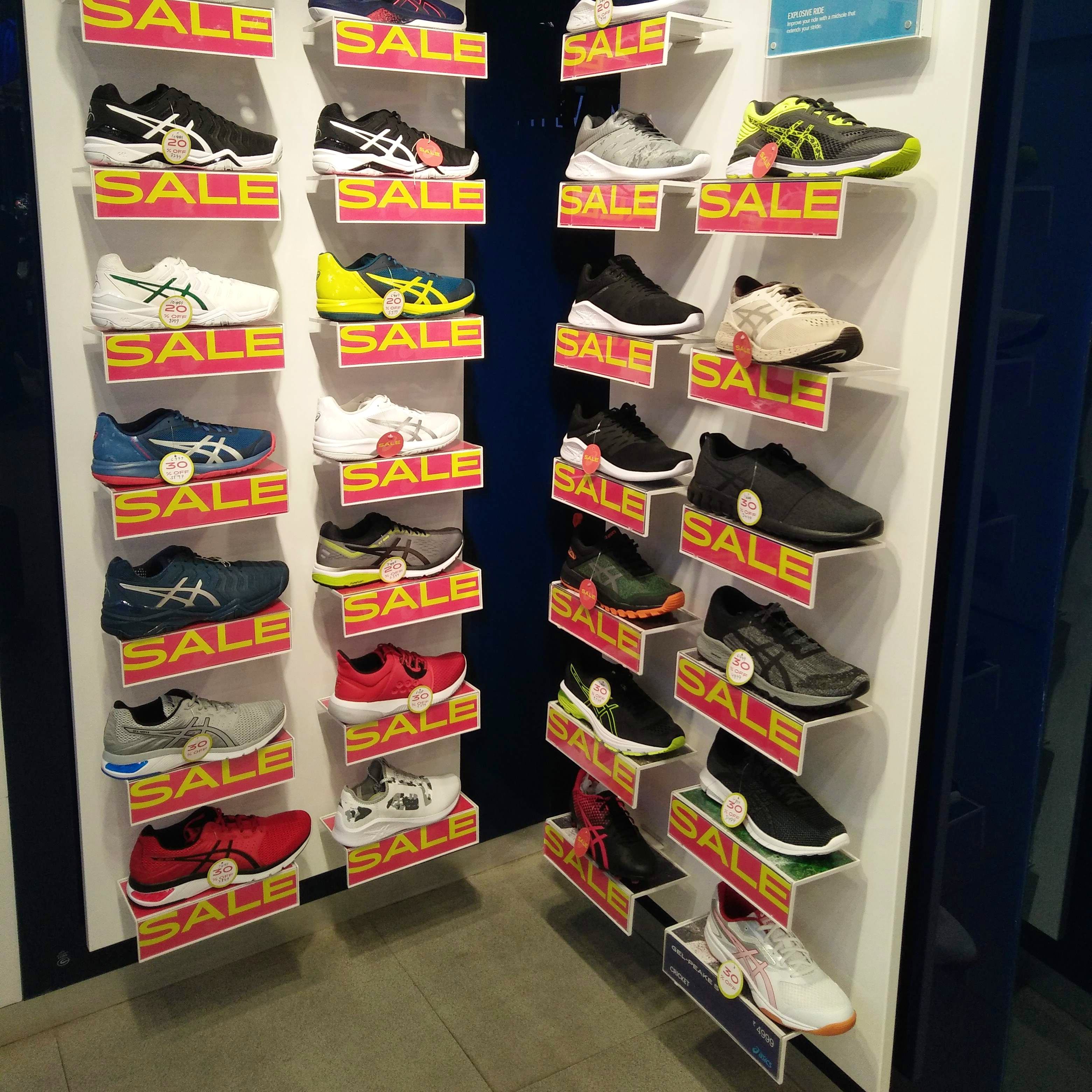 Shelf,Display case,Footwear,Shoe store,Shelving,Room,Furniture,Shoe,Retail,Athletic shoe