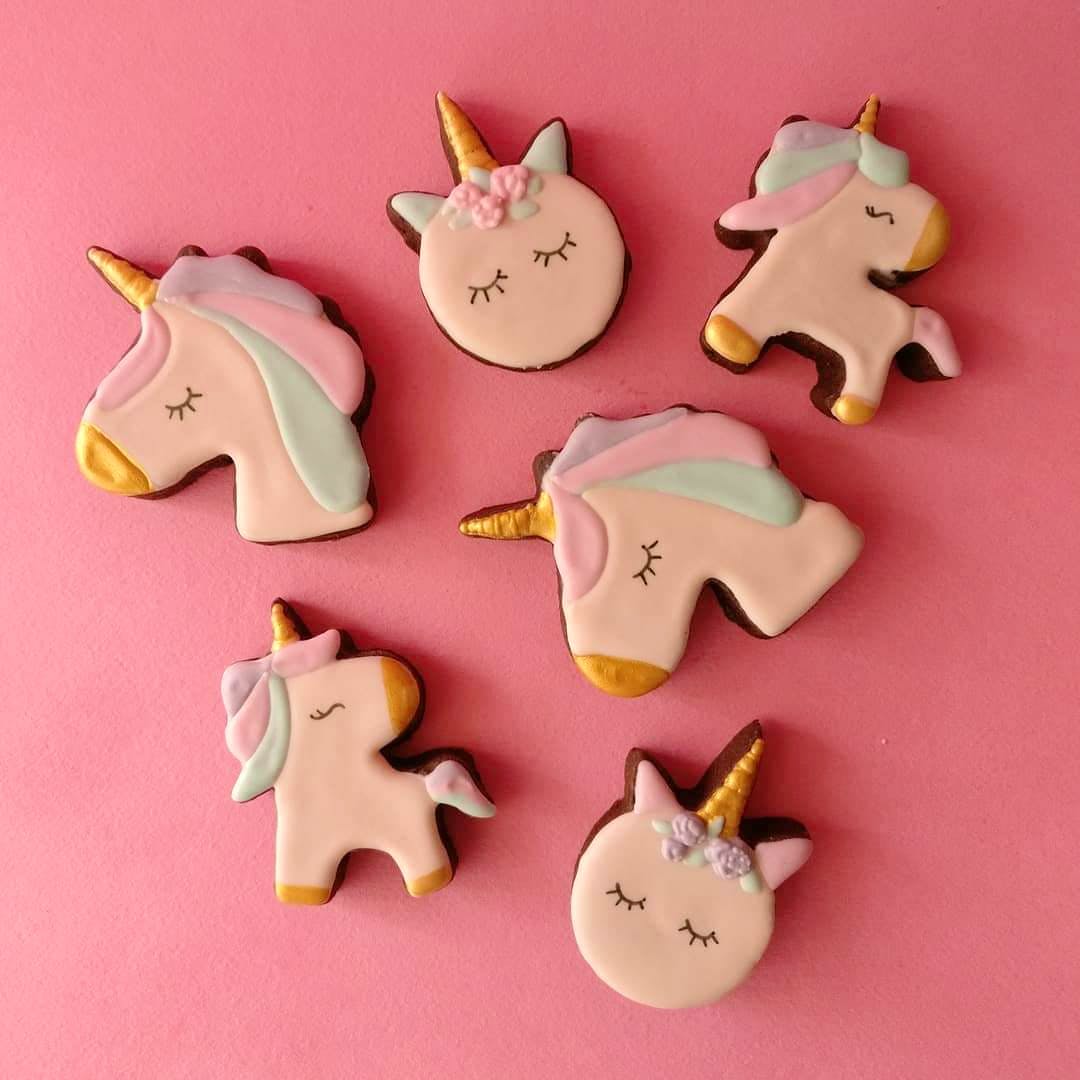 Icing,Pink,Royal icing,Cookie,Finger food,Animal cracker,Cookies and crackers,Fictional character,Fashion accessory,Unicorn