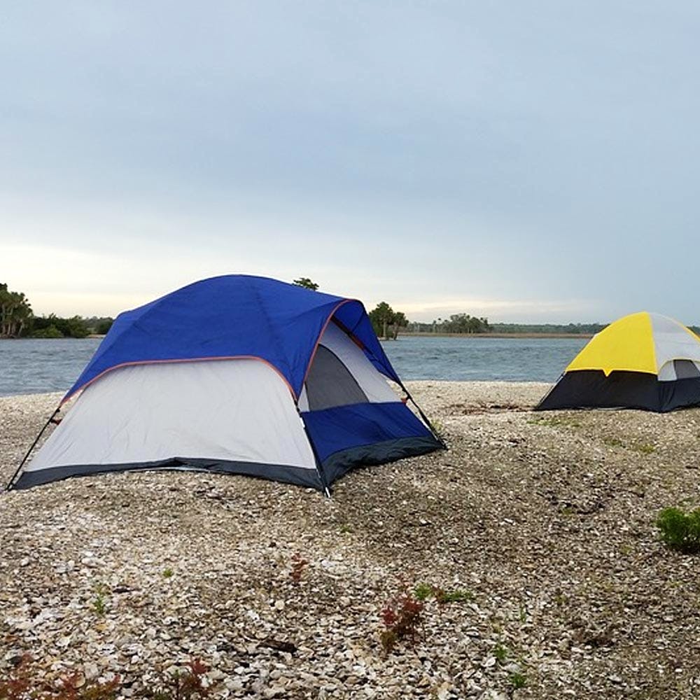 Tent,Camping,Blue,Sky,Natural environment,Wilderness,Grassland,Biome,Grass,Ecoregion