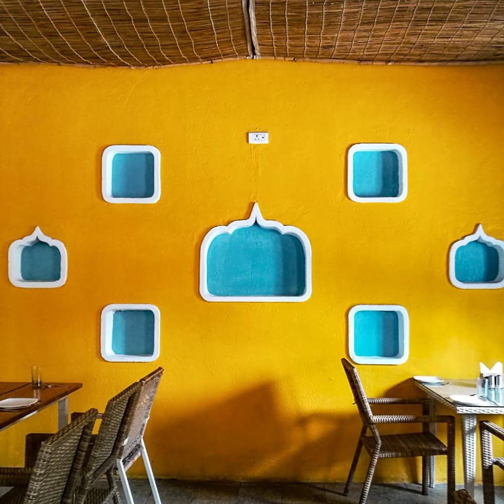 Yellow,Turquoise,Blue,Wall,Orange,Green,Room,Ceiling,Interior design,Furniture