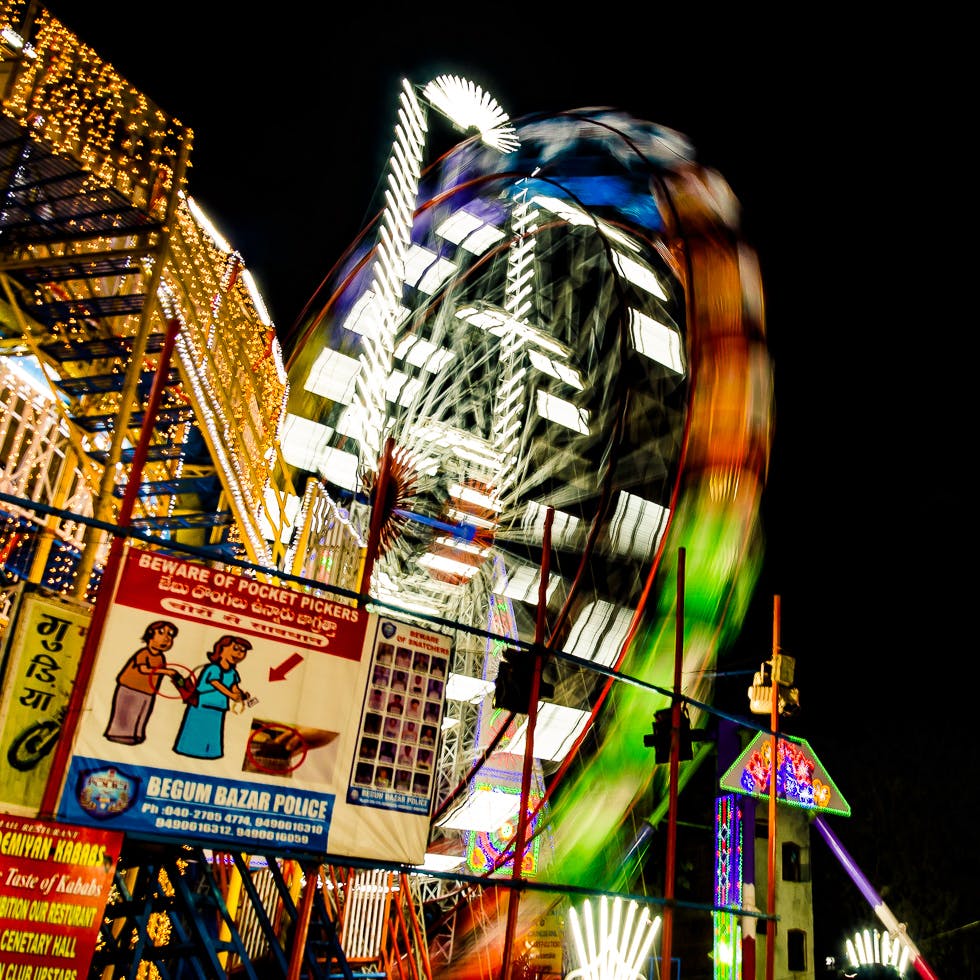 Fair,Amusement park,Amusement ride,Landmark,Tourist attraction,Night,Metropolis,Fun,Metropolitan area,Festival