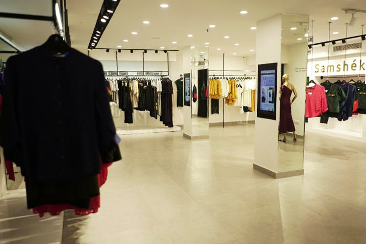 Boutique,Fashion,Outlet store,Event,Outerwear,Exhibition,Building,Interior design,Suit