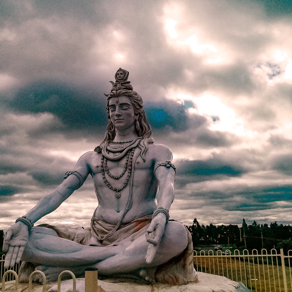 Statue,Sky,Landmark,Sculpture,Cloud,Sitting,Monument,Meditation,Art,Classical sculpture