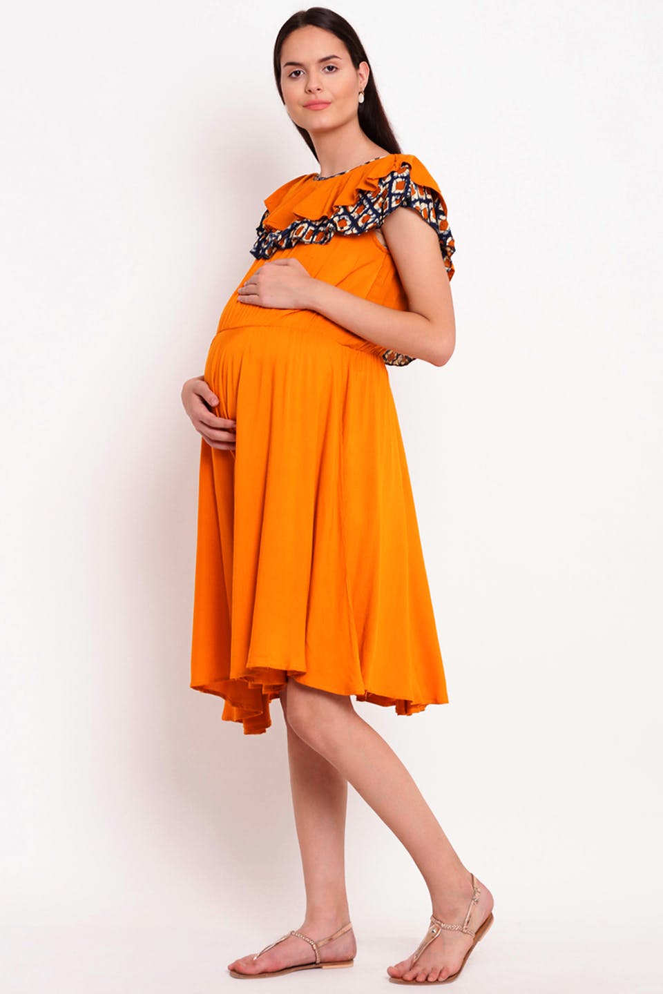 Clothing,Fashion model,Yellow,Orange,Day dress,Dress,Standing,One-piece garment,Cover-up,Neck