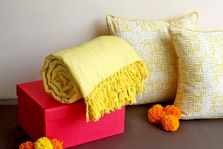 Yellow,Pillow,Throw pillow,Cushion,Orange,Textile,Furniture,Bedding,Linens,Room