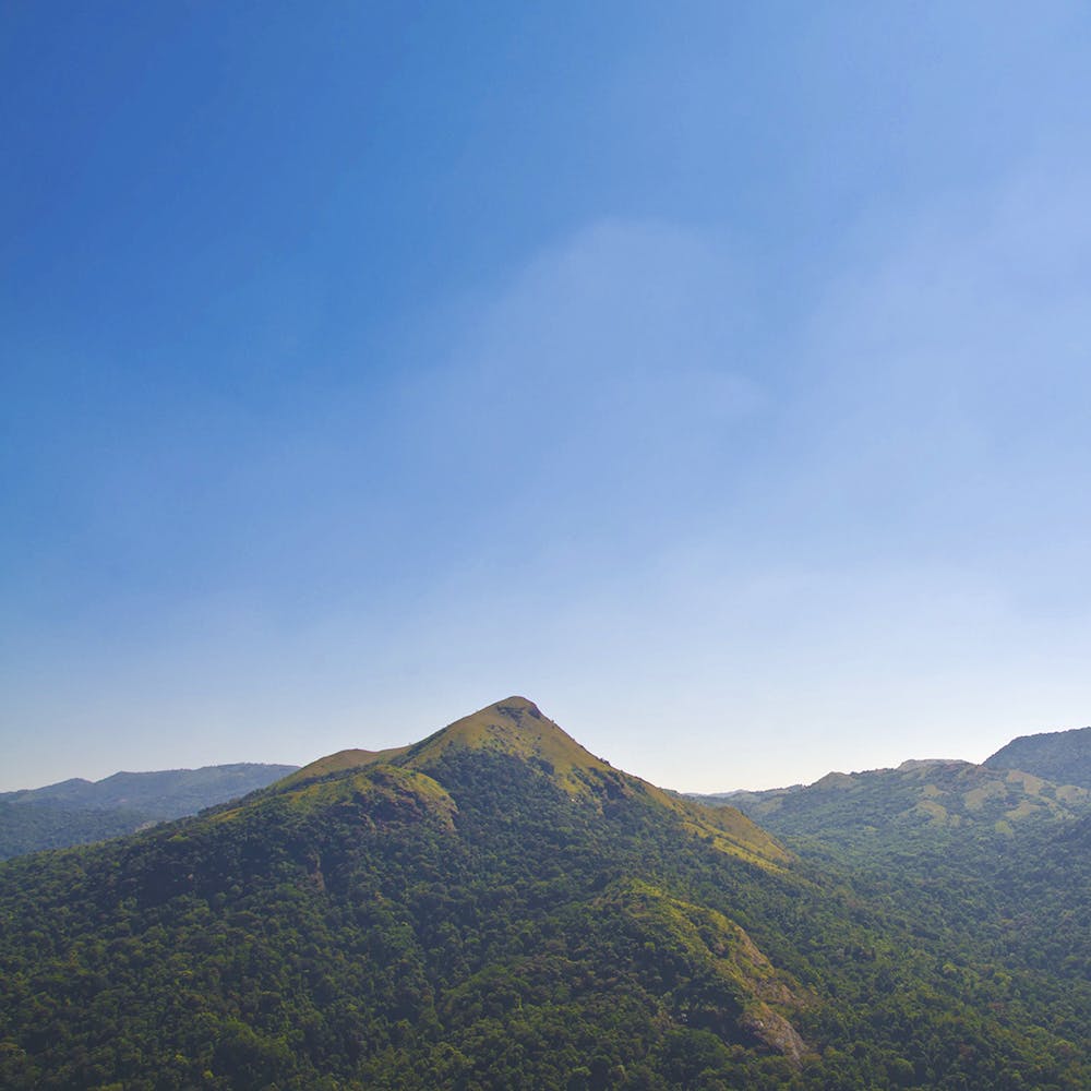 Mountainous landforms,Mountain,Highland,Sky,Ridge,Hill,Hill station,Mountain range,Atmospheric phenomenon,Fell