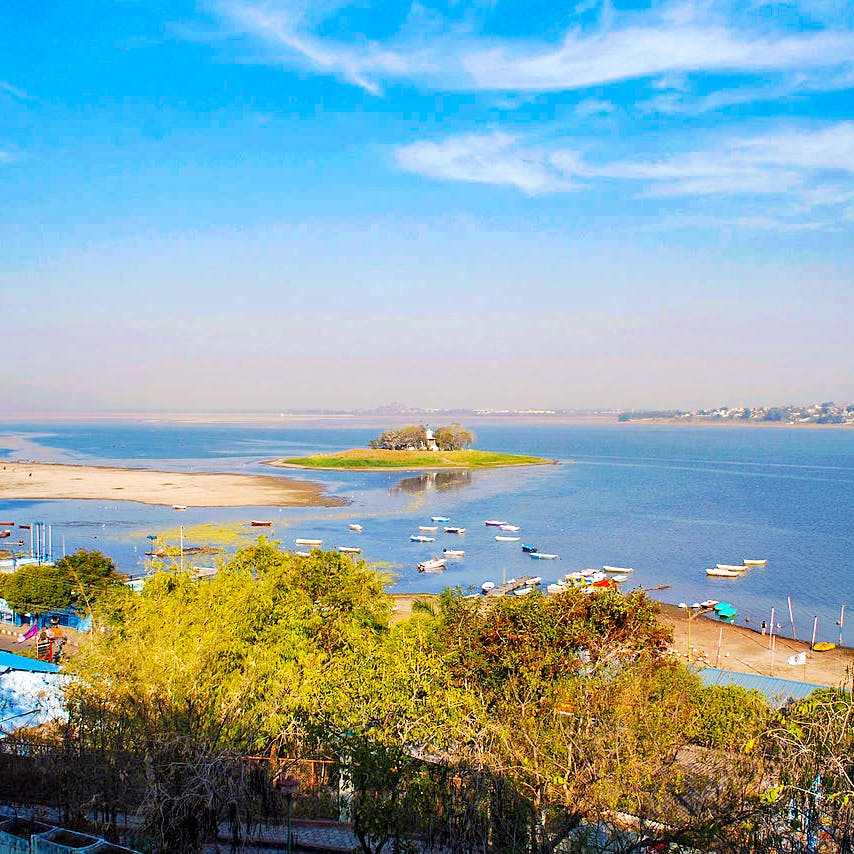 Body of water,Sky,Sea,Coast,Natural landscape,Yellow,Shore,Ocean,Bay,Coastal and oceanic landforms