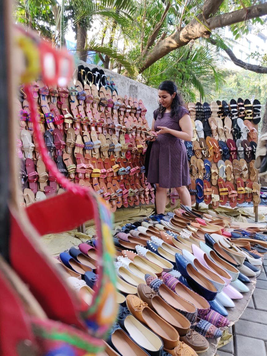 Selling,Footwear,Public space,Pink,Textile,Spring,Shoe,Street fashion,Dress,Bazaar