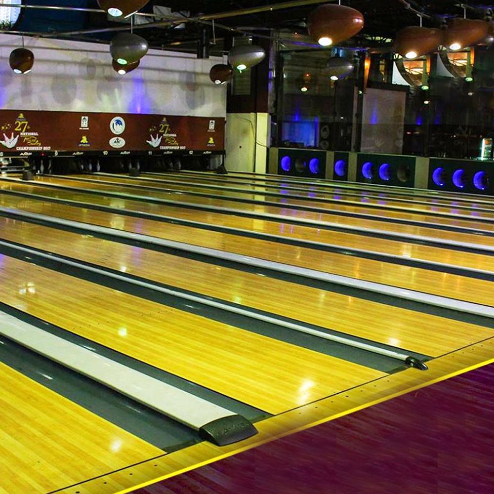 Bowling,Ten-pin bowling,Yellow,Bowling equipment,Floor,Bowling pin,Duckpin bowling,Ball game,Flooring,Individual sports