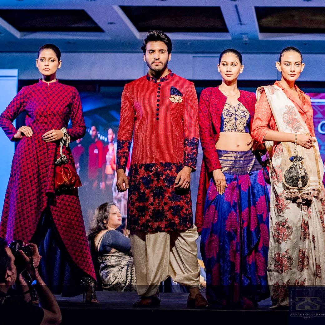 Event,Fashion,Fashion design,Performance,Stage,Formal wear,Sari,Textile,Magenta,Ceremony