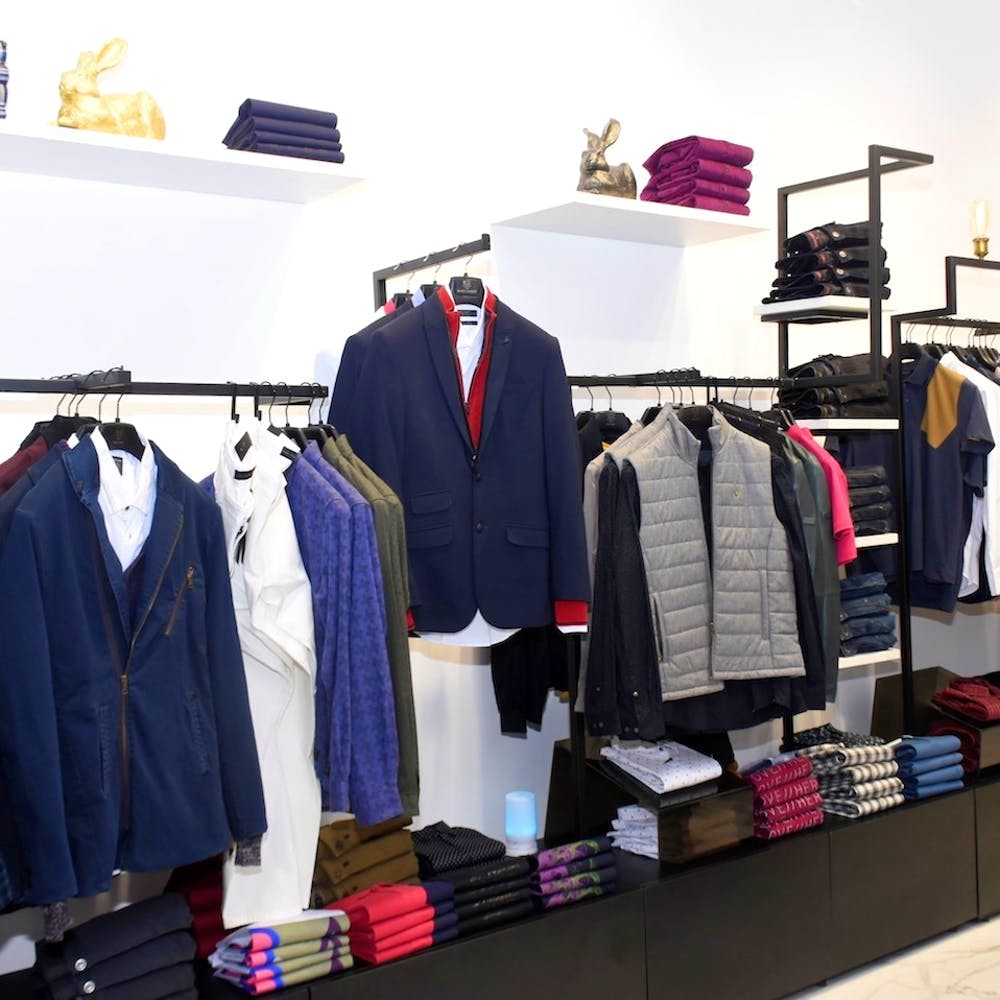 Clothes hanger,Clothing,Boutique,Room,Closet,Suit,Shelf,Formal wear,Outlet store,Wardrobe