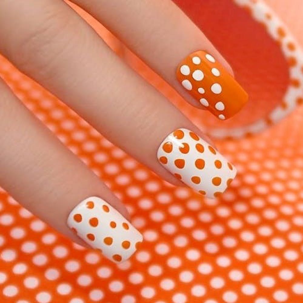 Nail,Orange,Nail polish,Nail care,Polka dot,Finger,Manicure,Cosmetics,Pattern,Design