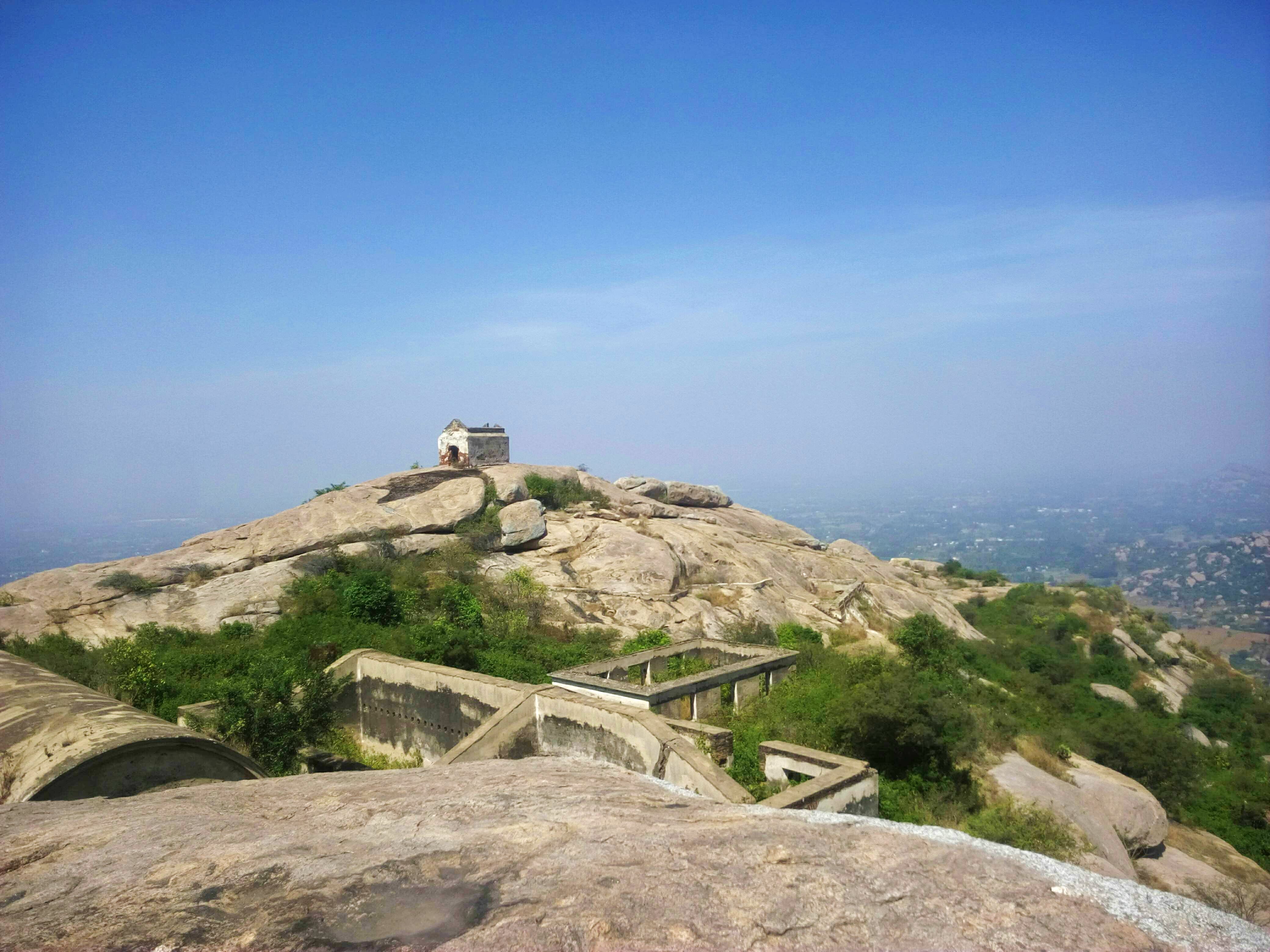 Mountainous landforms,Mountain,Rock,Ridge,Sky,Hill,Summit,Outcrop,Bedrock,Terrain