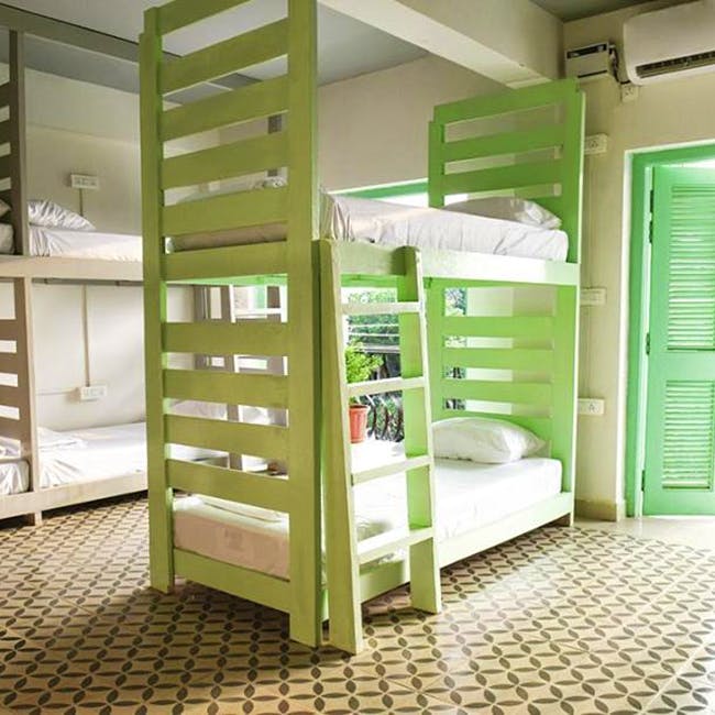 Green,Furniture,Bed,Room,Bunk bed,Hostel,Interior design,Building,Stairs,Shelf
