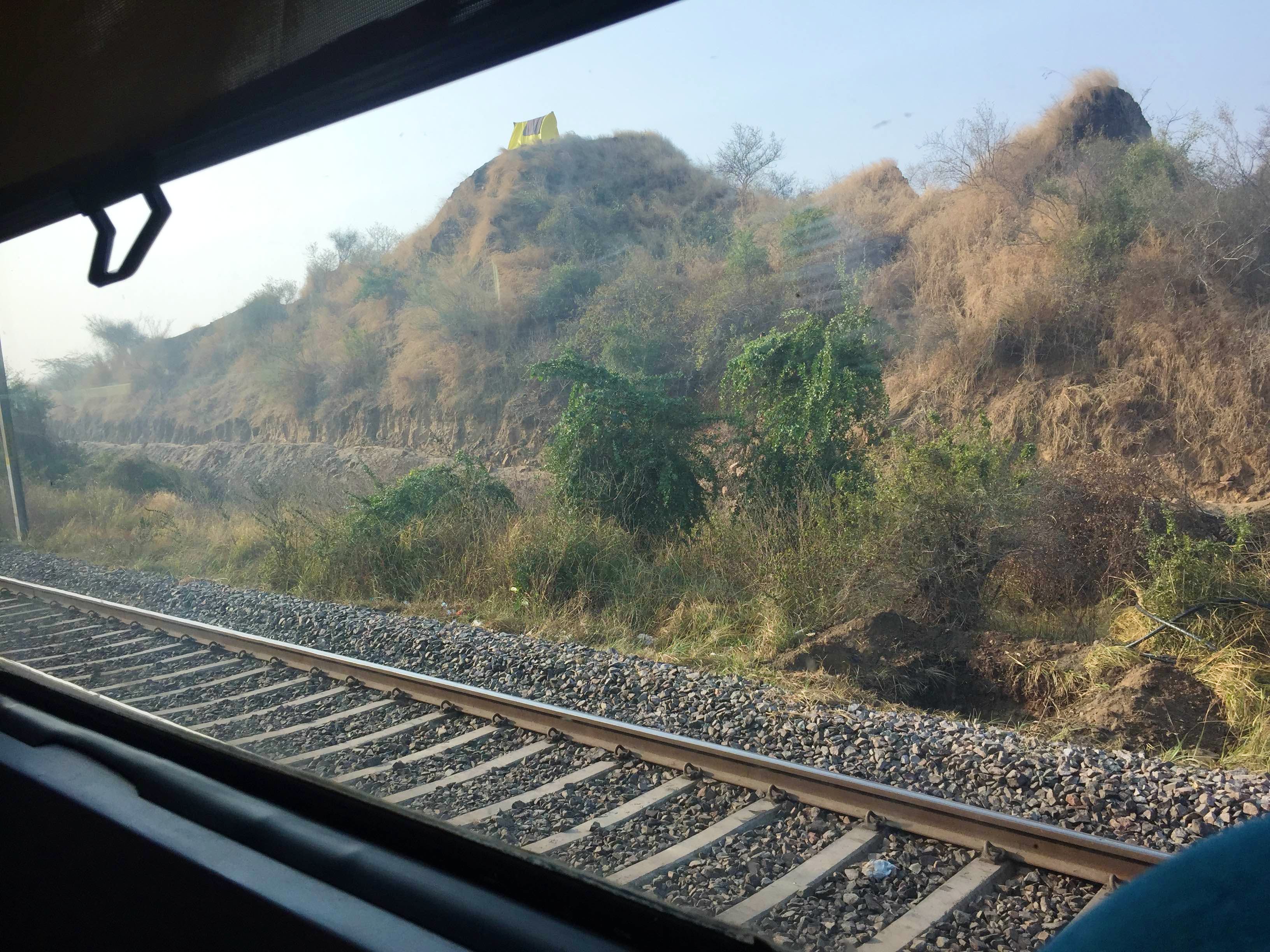 Transport,Sky,Mountain,Track,Tree,Cloud,Vehicle,Highland,Hill station,Railway