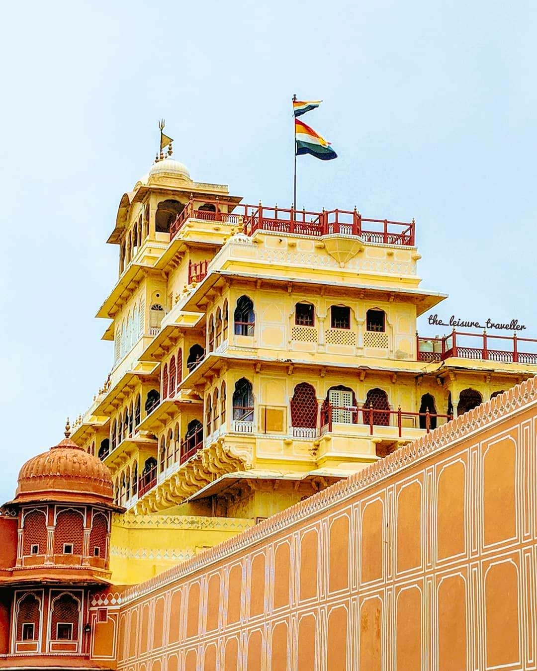 Landmark,Architecture,Building,Yellow,Palace,Facade,Classical architecture,Flag,Tourism,Balcony