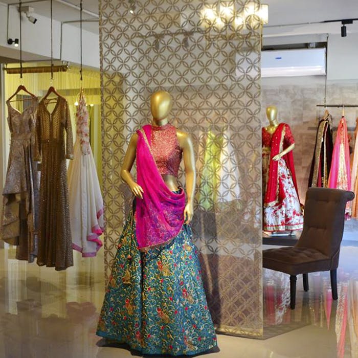 Boutique,Clothing,Dress,Fashion,Retail,Textile,Fashion design,Formal wear,Display window,Room