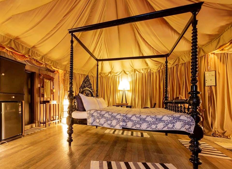 Canopy bed,Bed,Furniture,Bedroom,Room,four-poster,Property,Interior design,Building,Lighting