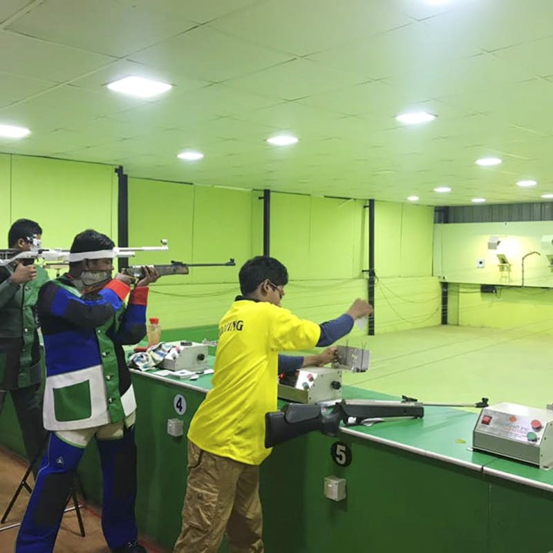 Shooting sport,Shooting,Recreation,Gun,Sports,Shooting range,Sport venue,Room,Individual sports,Air gun