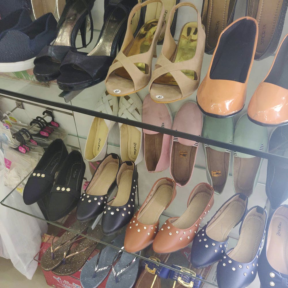 Footwear,Shoe,Shoe store,High heels,Sandal,Ballet flat,Court shoe,Slipper,Pointe shoe,Leather