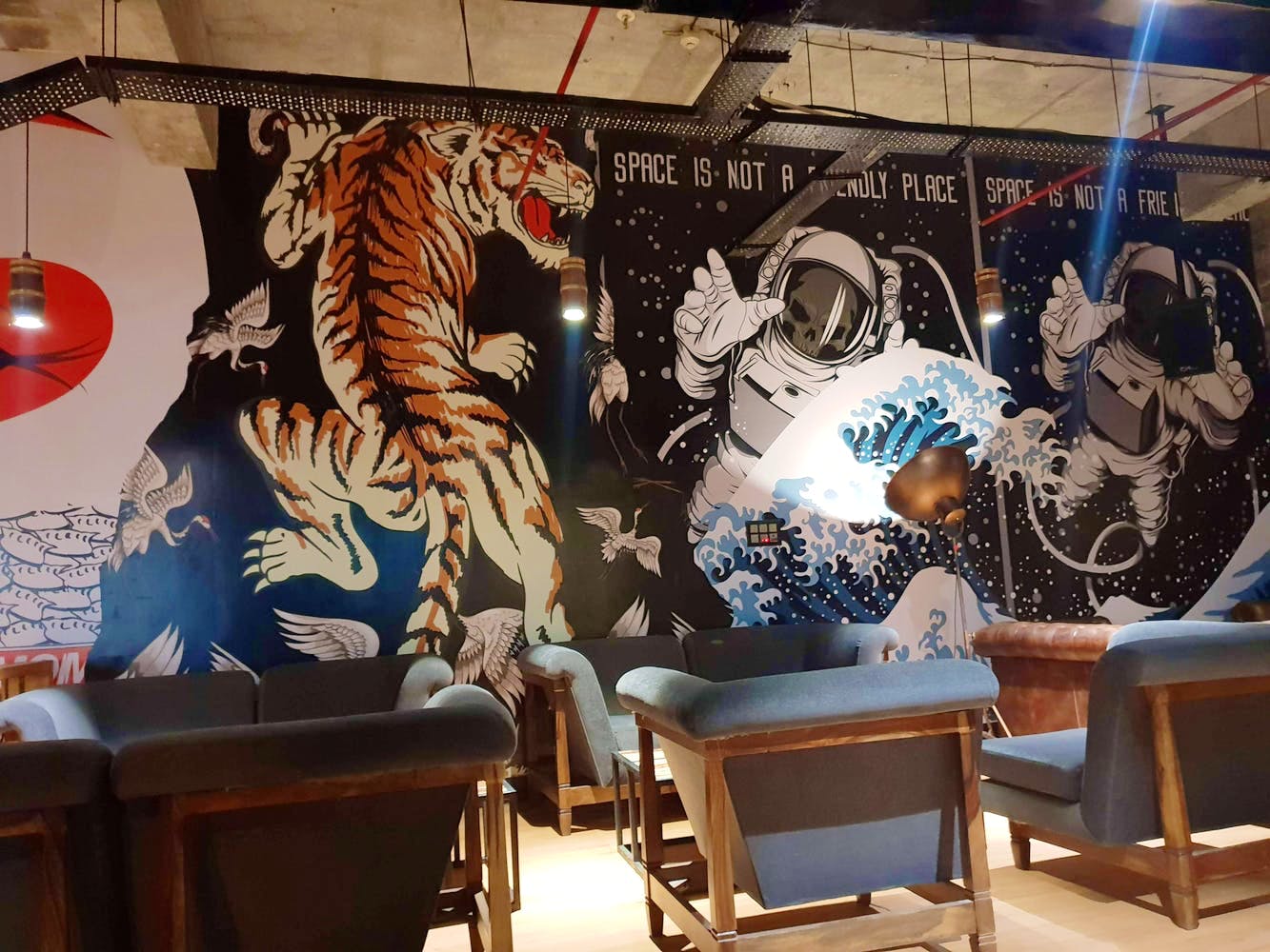 Wall,Room,Mural,Interior design,Tiger,Art,Design,Restaurant,Table,Felidae
