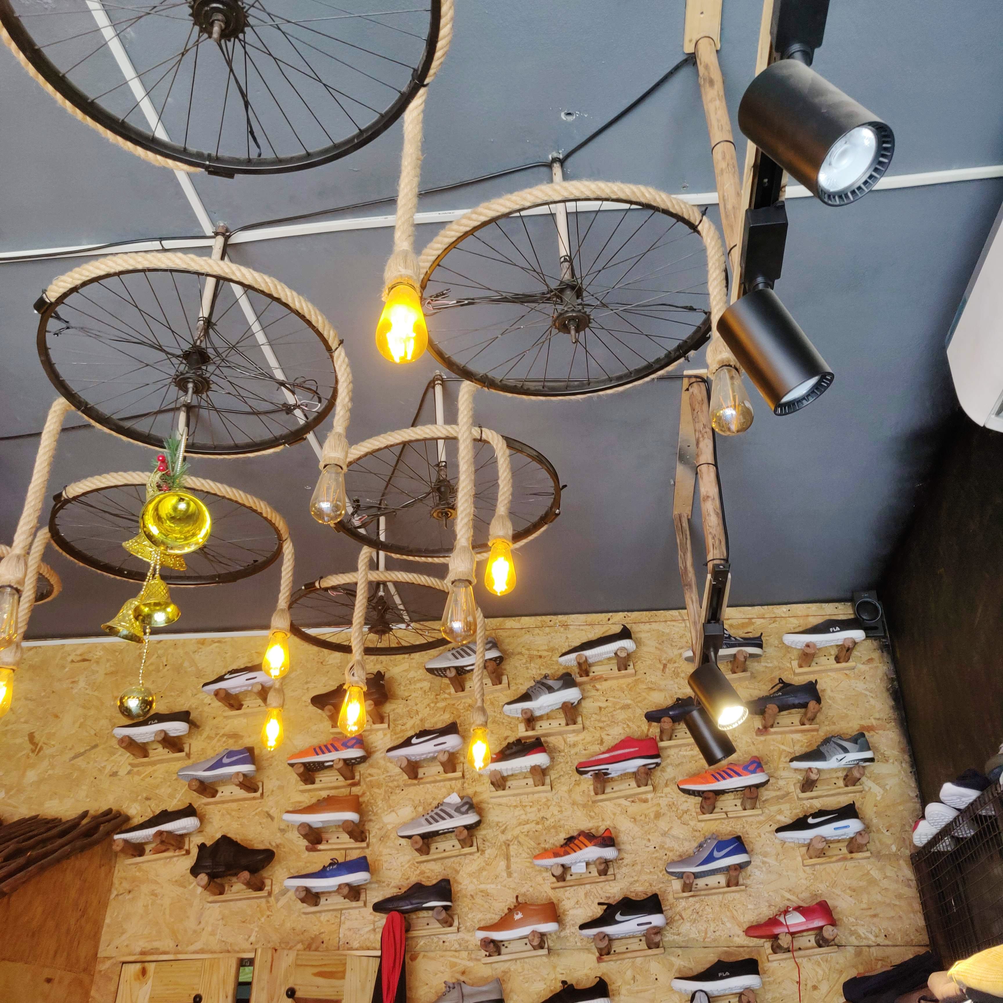 Lighting,Bicycle wheel,Bicycle part,Bicycle,Light fixture,Chandelier,Iron,Metal,Room,Bicycle fork