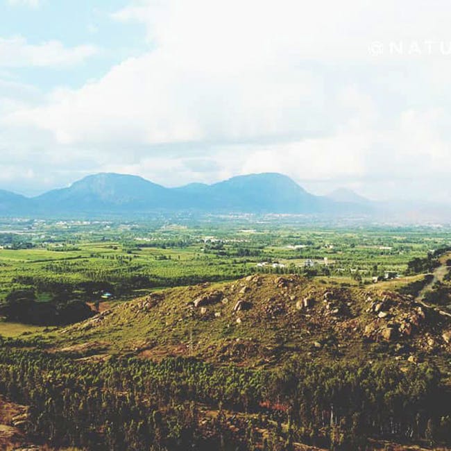 Mountainous landforms,Highland,Hill,Sky,Mountain,Hill station,Natural landscape,Cloud,Wilderness,Atmospheric phenomenon