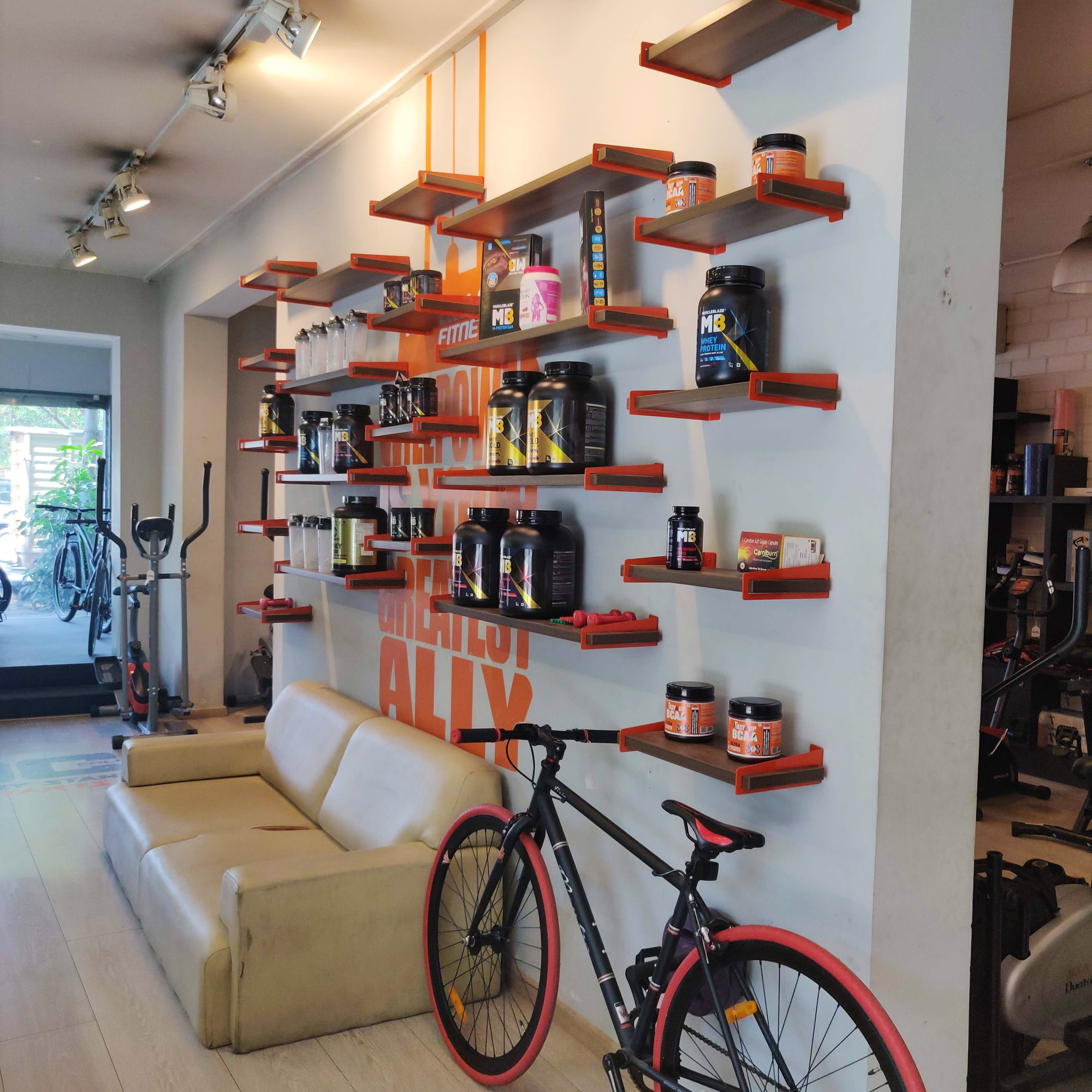 Shelf,Shelving,Bicycle wheel,Bicycle,Room,Building,Bicycle fork,Vehicle,Bicycle part,Interior design