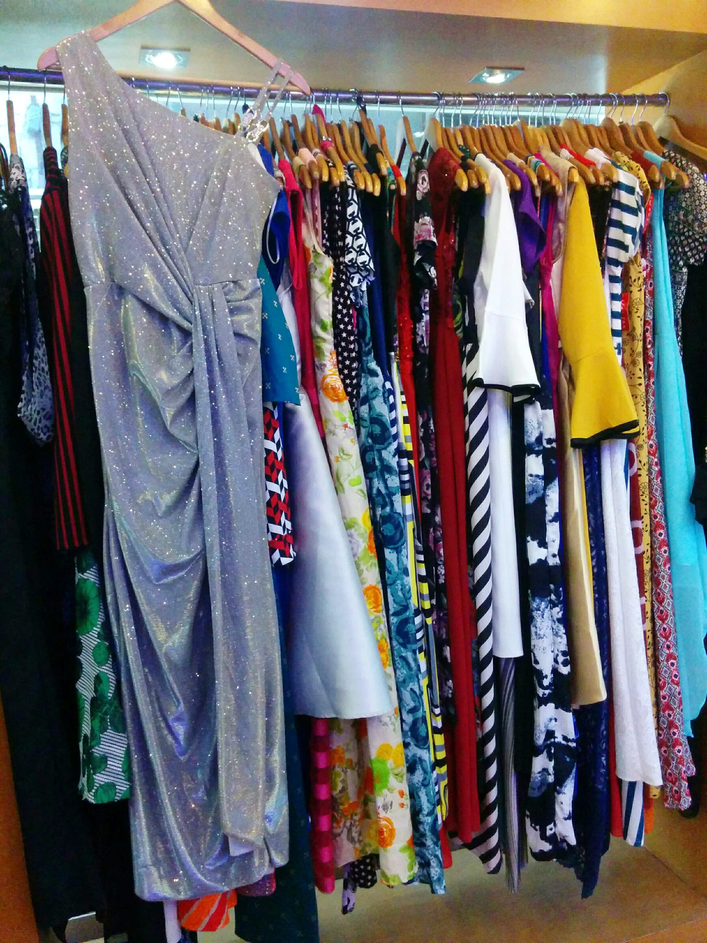 Clothing,Room,Closet,Boutique,Clothes hanger,Textile,Dress,Furniture,Wardrobe