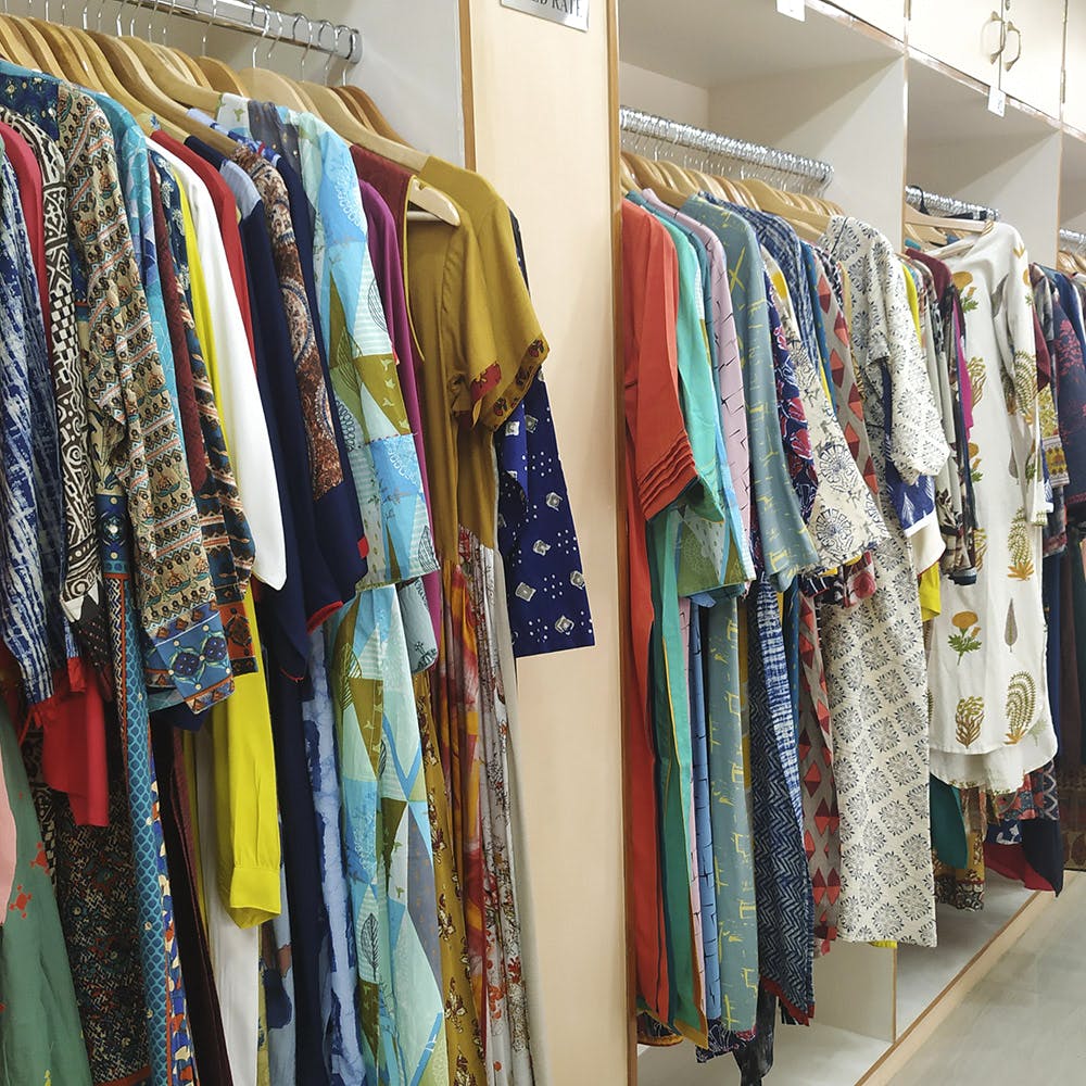 Clothing,Room,Clothes hanger,Boutique,Closet,Textile,Furniture,Dress,Outlet store,Wardrobe