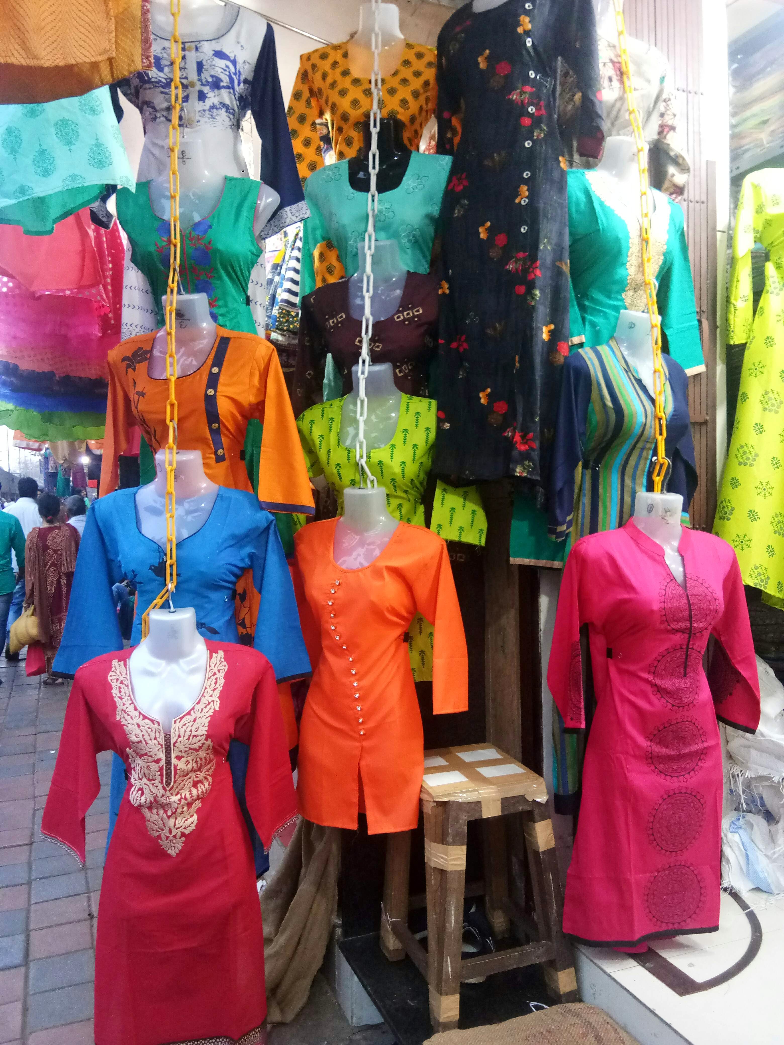 Bazaar,Public space,Selling,Display window,Retail,Market,Temple,Mannequin,Textile,Shopping