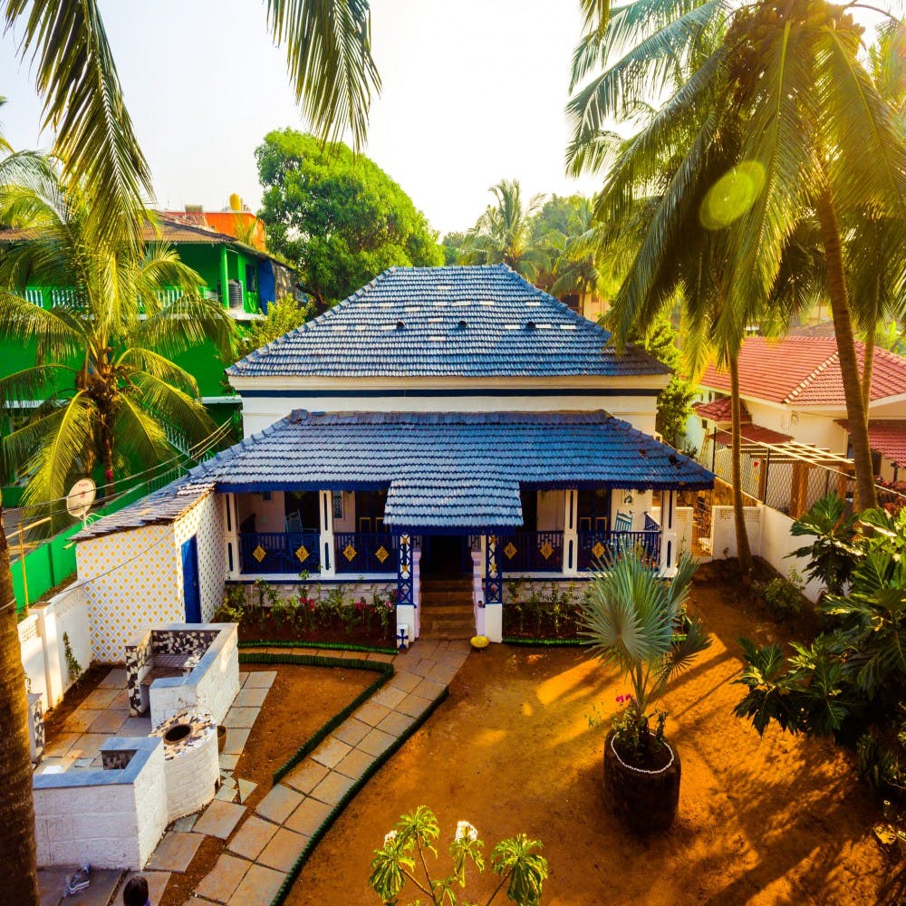 House,Property,Home,Building,Resort,Architecture,Tropics,Real estate,Majorelle blue,Tree