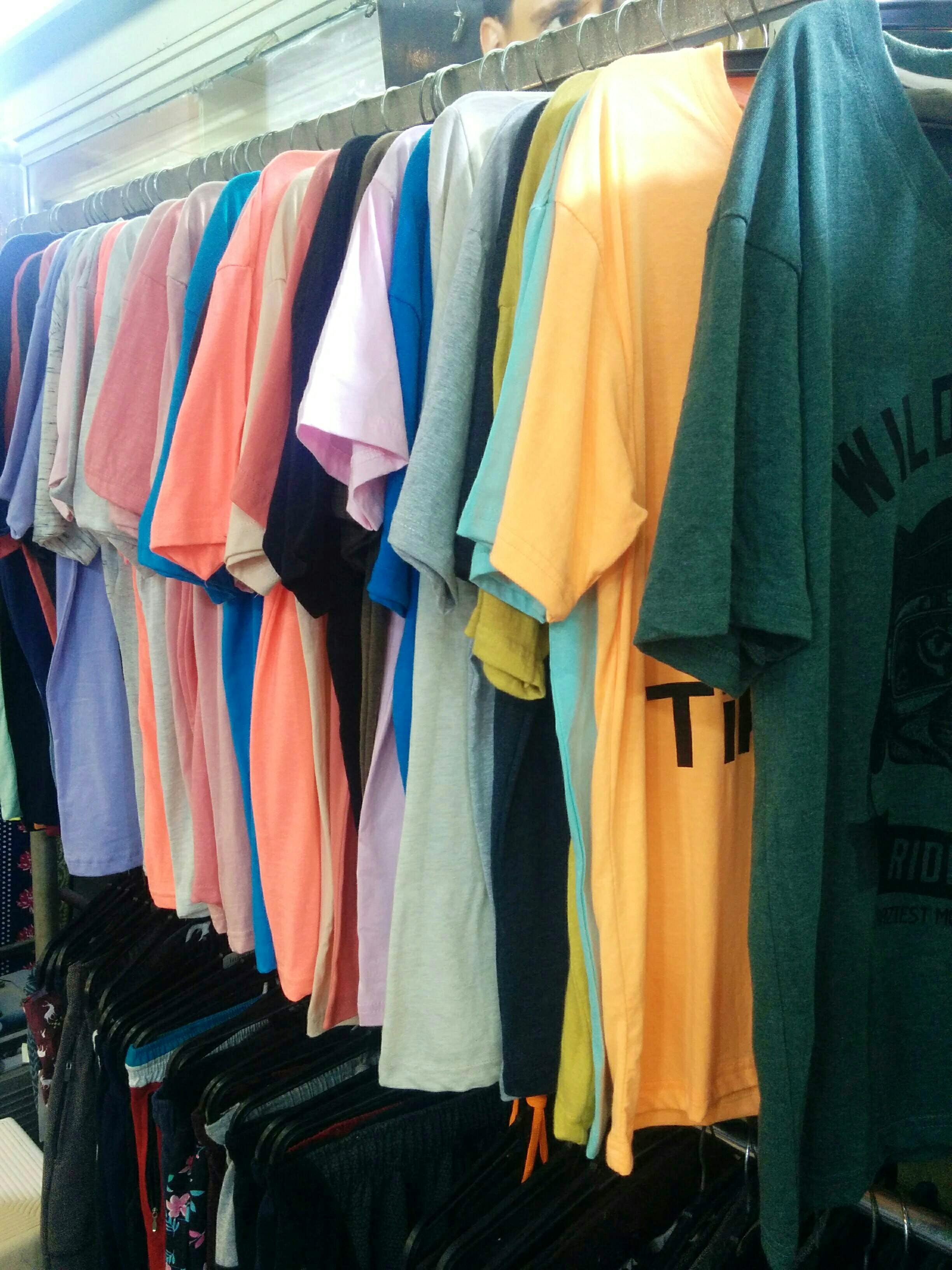 Clothing,T-shirt,Room,Clothes hanger,Textile,Boutique,Outerwear,Laundry,Closet,Linens