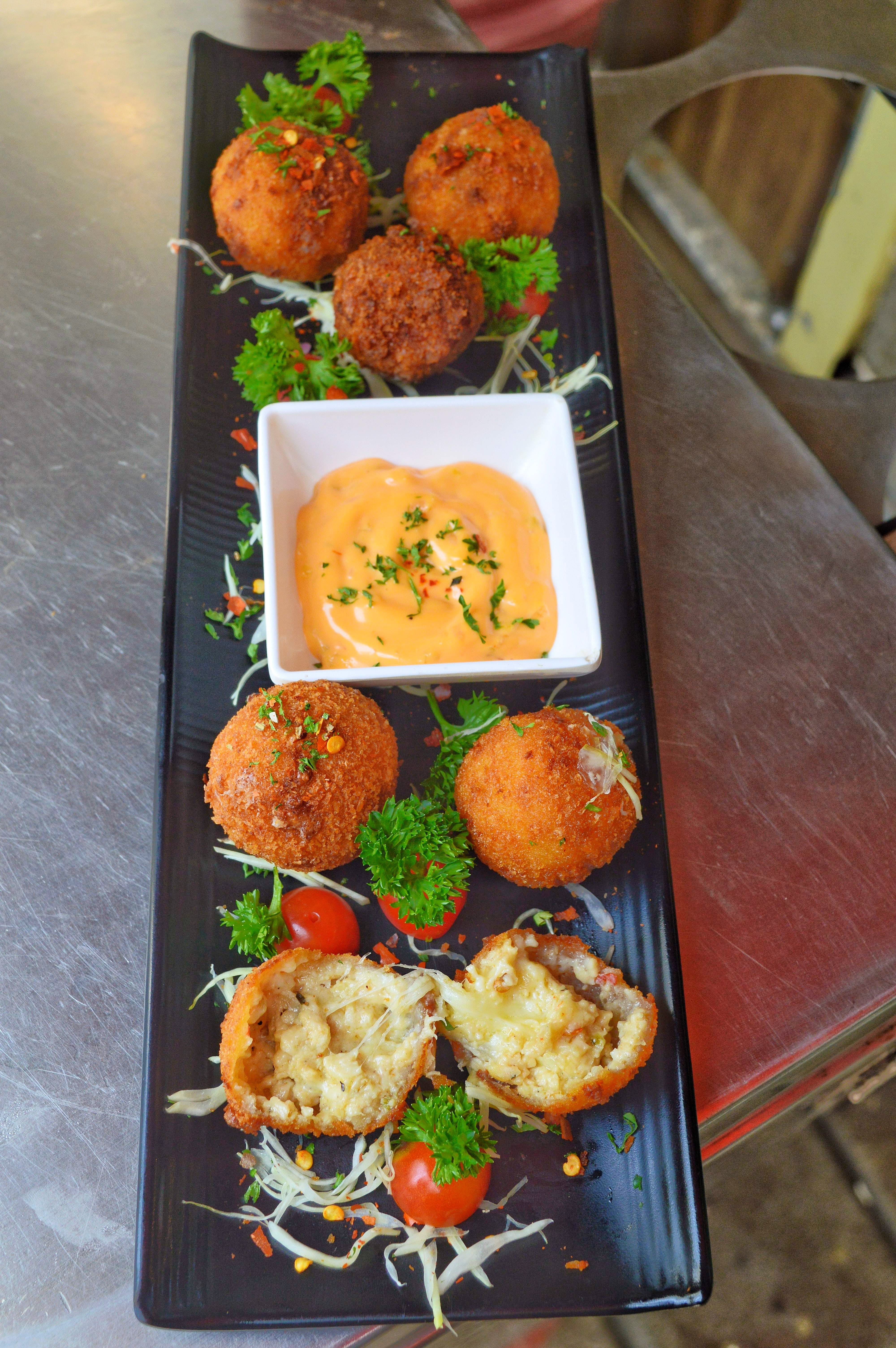 Dish,Food,Cuisine,Ingredient,Comfort food,Fried food,Side dish,Meatball,Produce,Arancini