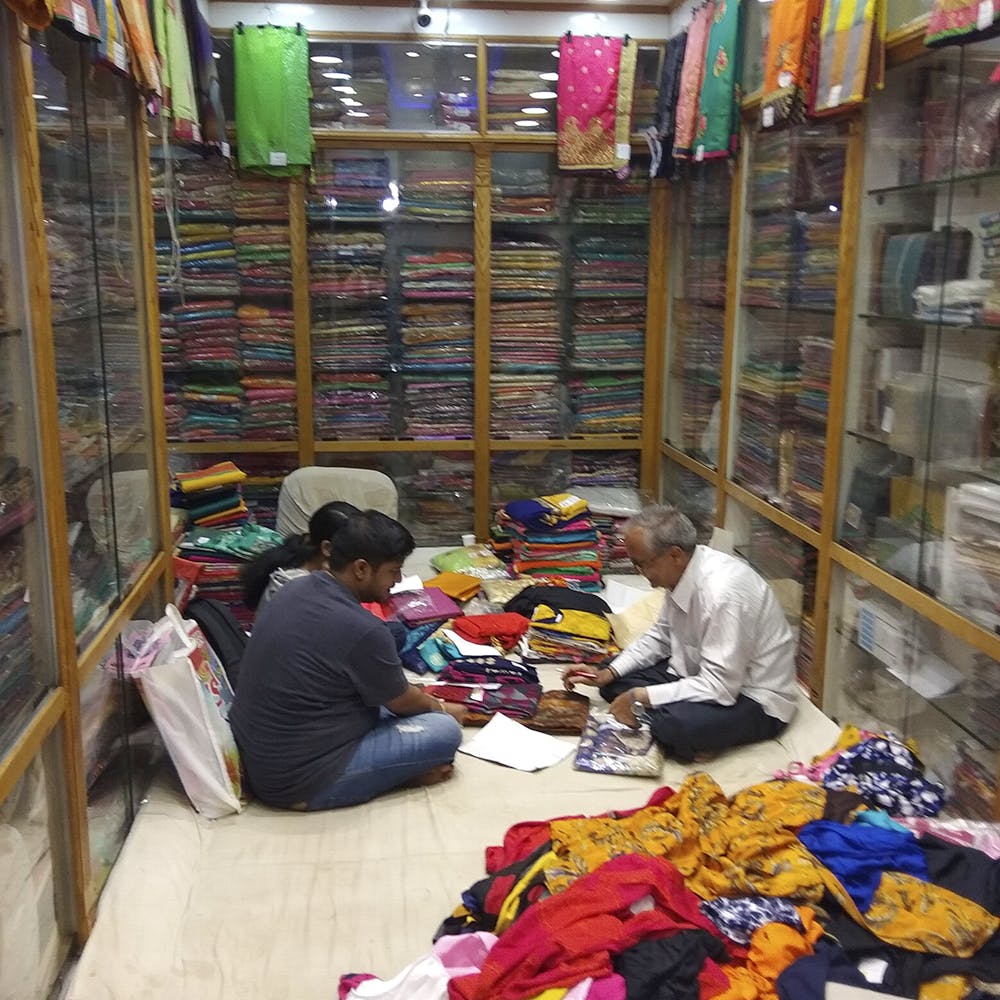 Selling,Marketplace,Public space,Bazaar,Market,Retail,Convenience store,Textile,Shopkeeper,Customer