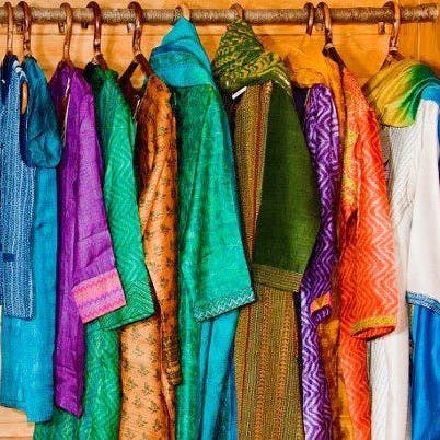 Clothing,Silk,Textile,Clothes hanger,Boutique,Stole,Room,Fashion design,Outerwear,Sari