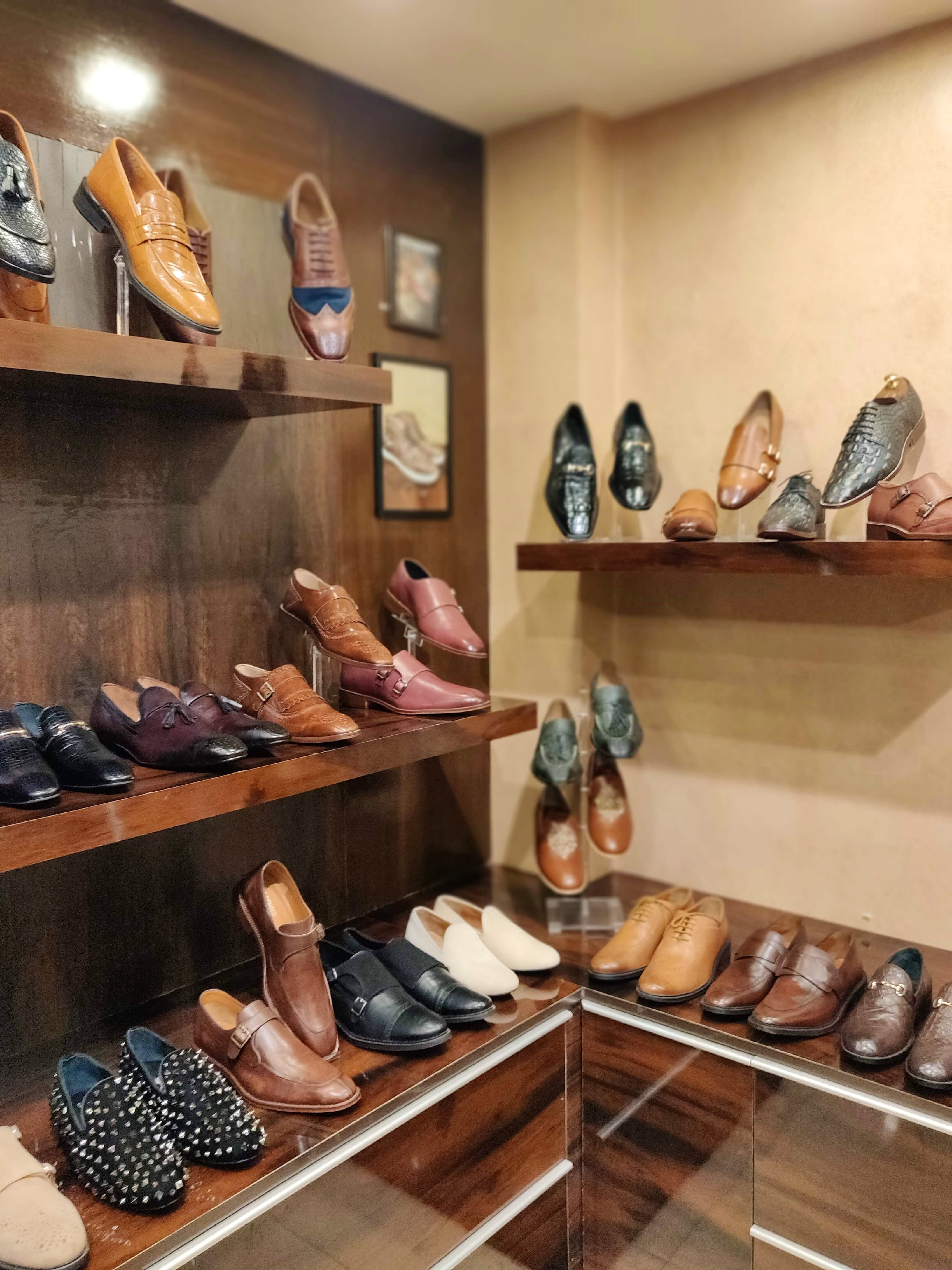 Shoe store,Shelf,Footwear,Room,Shoe,Collection,Display case,Interior design,Shelving,Building