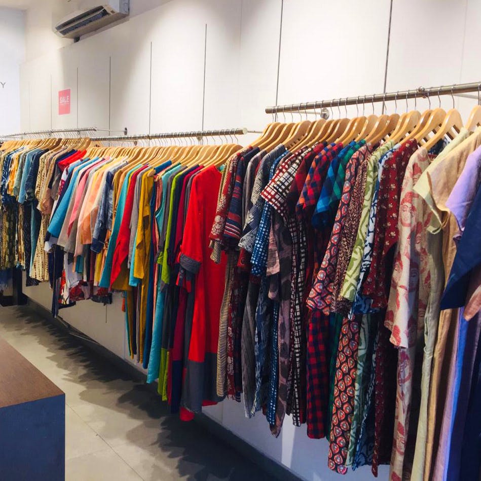 Boutique,Clothing,Room,Fashion,Textile,Outlet store,Outerwear,Clothes hanger,Fashion design,Closet
