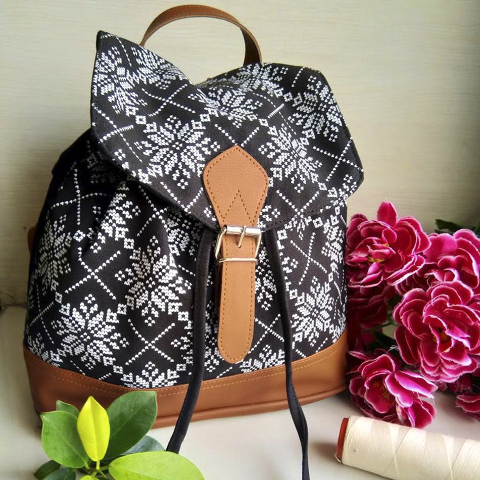 Bag,Product,Handbag,Pink,Backpack,Fashion accessory,Design,Material property,Font,Satchel