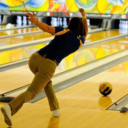 Bowling,Ten-pin bowling,Bowler,Bowling equipment,Ball,Sports,Ball game,Yellow,Bowling pin,Bowling ball