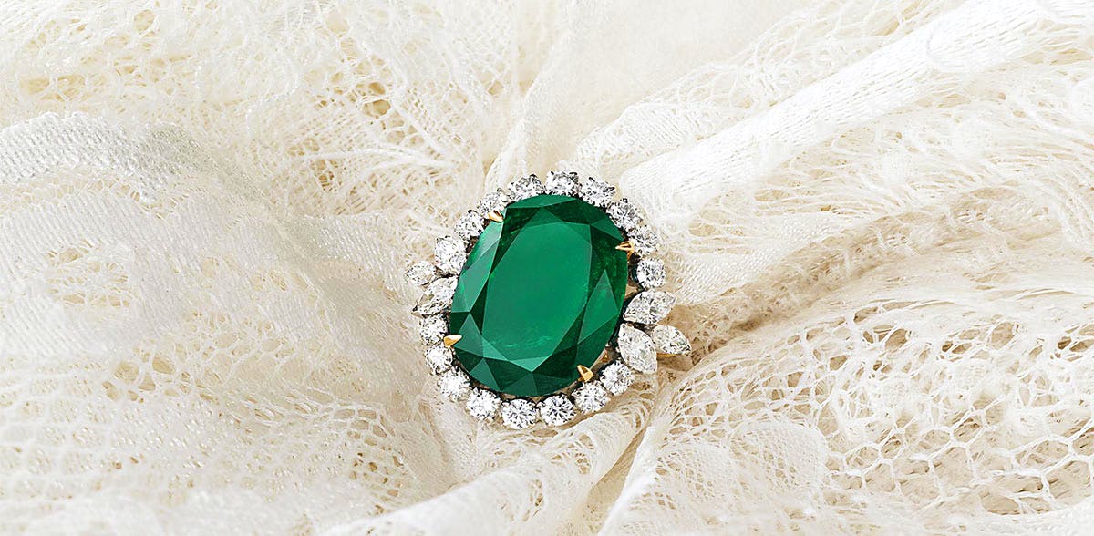 Emerald,Jewellery,Fashion accessory,Gemstone,Engagement ring,Ring,Body jewelry,Wedding ceremony supply,Wedding ring,Platinum