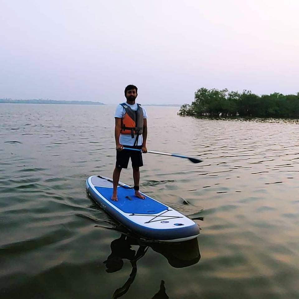 Water transportation,Surface water sports,Surfing Equipment,Recreation,Outdoor recreation,Stand up paddle surfing,Water sport,Vehicle,Water,Surfboard