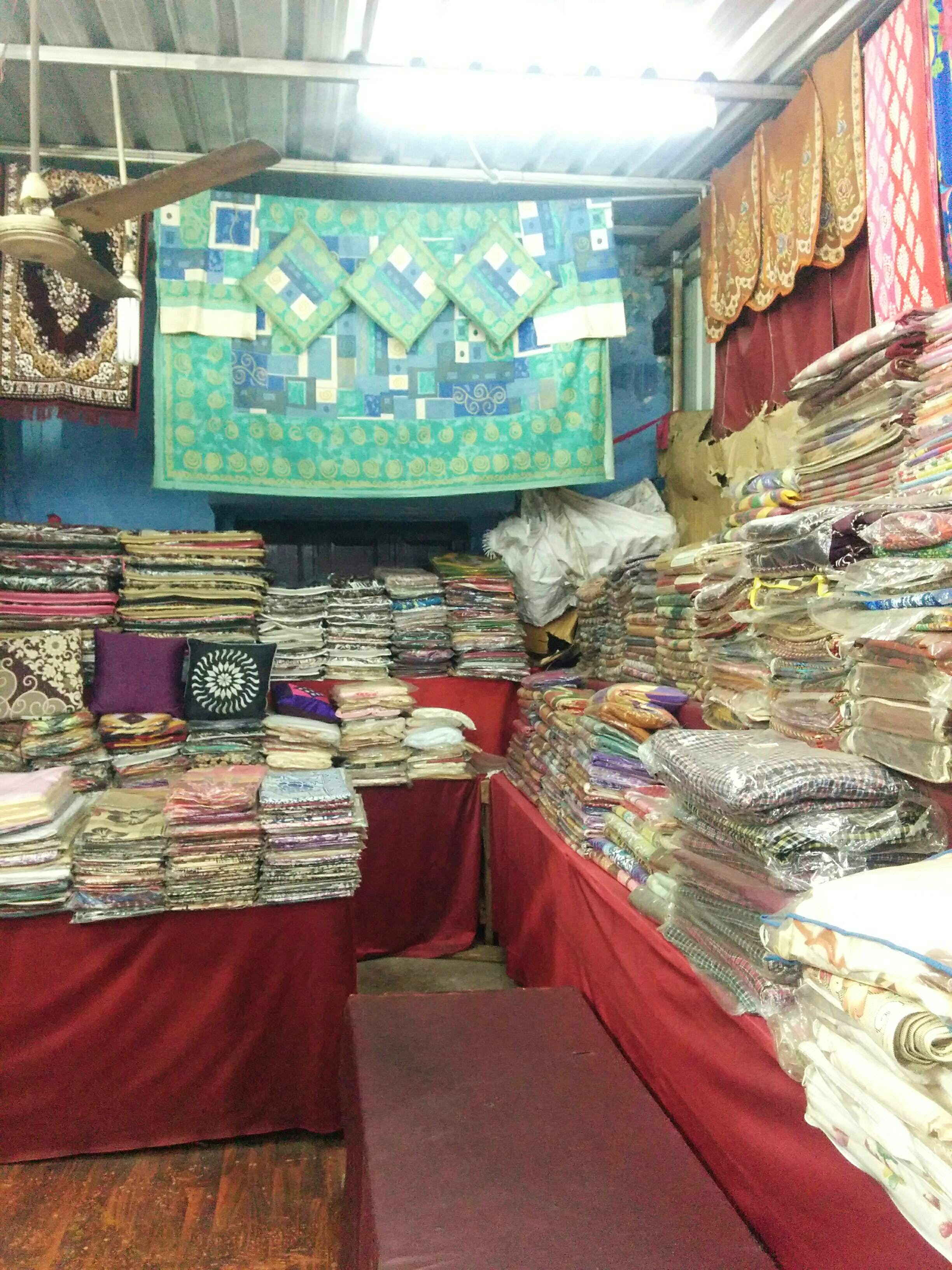 Textile,Bazaar,Linens,Market,Building,Interior design,Furniture