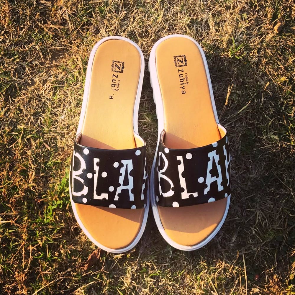 Footwear,Slipper,Shoe,Yellow,Orange,Sandal,Plimsoll shoe,Font,Flip-flops,Brand