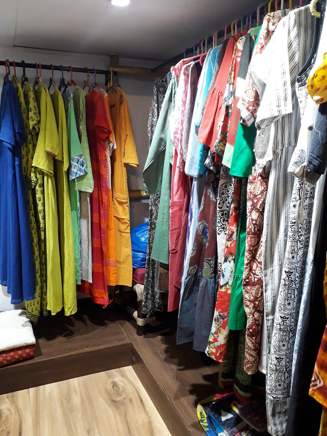 Room,Clothing,Closet,Boutique,Textile,Clothes hanger,Wardrobe,Outlet store,Furniture,Dress