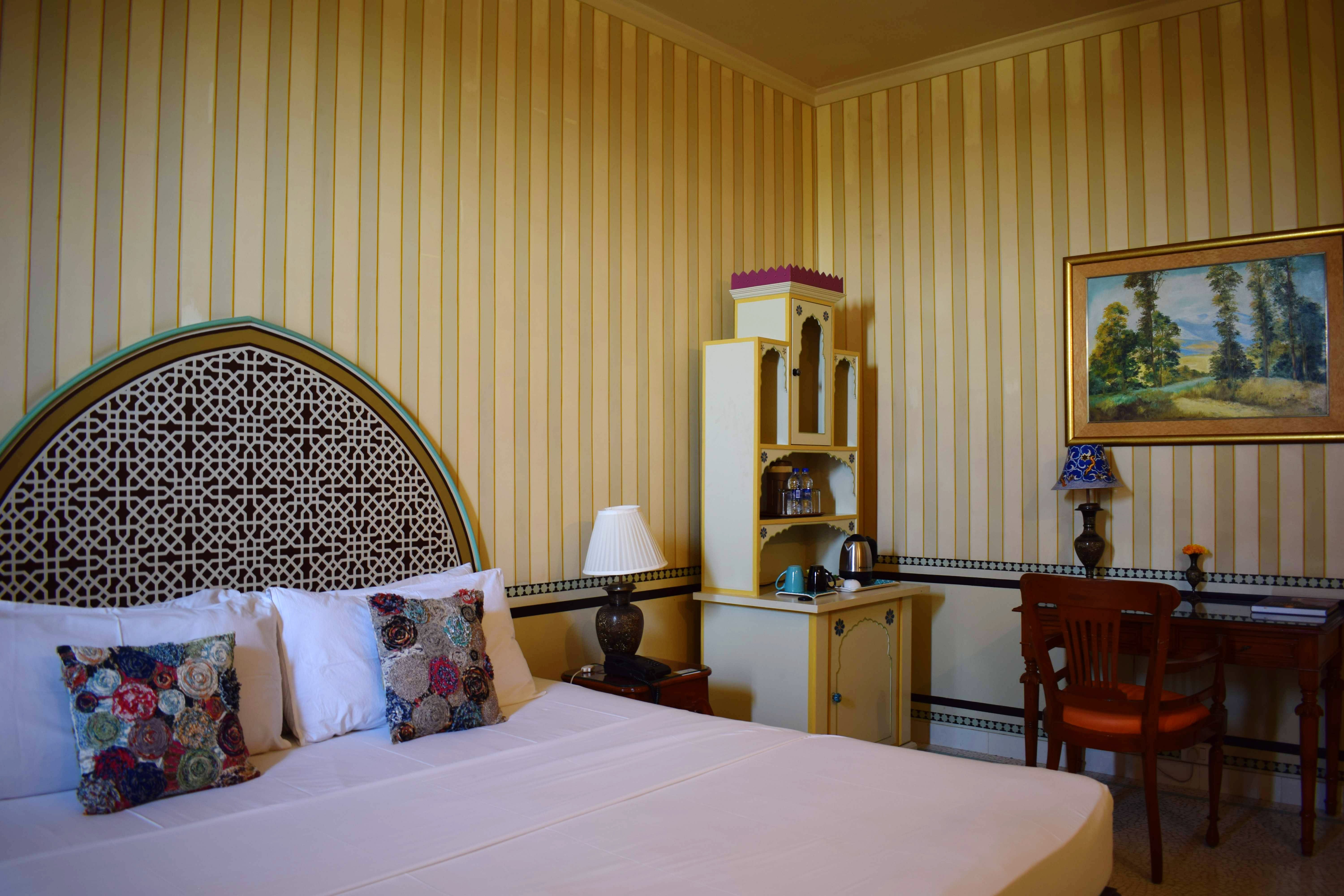 Room,Bedroom,Bed,Furniture,Bed sheet,Property,Bed frame,Interior design,Wall,Architecture