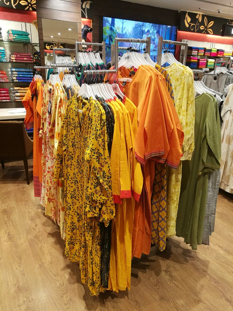 Bazaar,Clothing,Selling,Public space,Marketplace,Market,Outlet store,Boutique,Yellow,Retail