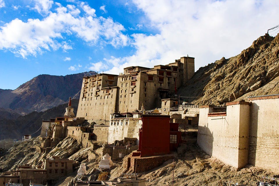 Sky,Mountain,Wall,Building,Ruins,Architecture,Landscape,Historic site,Tourism,Village