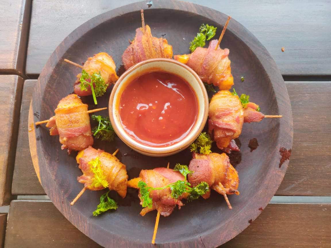 Swing By This Quaint Restaurant For Some Yum Bacon Wrapped Prawns