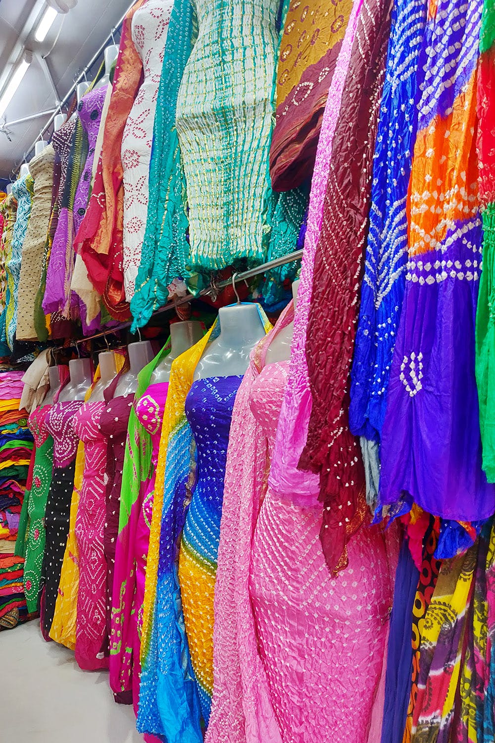 beautiful Indian women in colorful saris, colorful streetlife on market of  Jodhpur, Rajasthan, India Stock Photo - Alamy